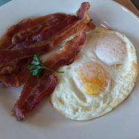 Waffle Combo · A whole waffle served with two eggs any style and your choice of two strips of bacon, two sa...