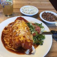 Brisket Burrito Plate · Large flour tortilla filled with beans and your choice of  brisket or steak, cheese, smother...