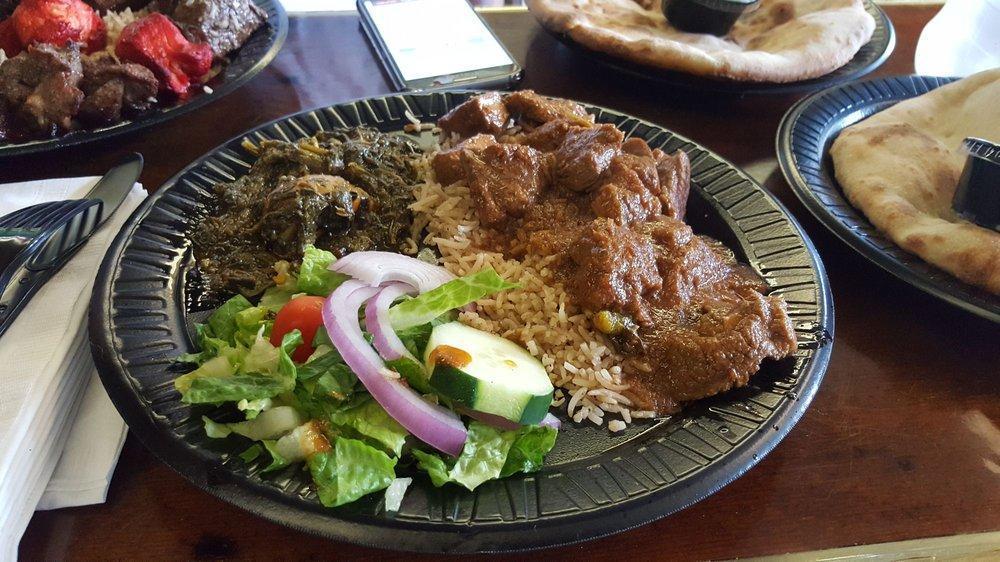 Achar Gosht Special · Spicy boneless lamb curry. Served with naan, rice, salad, green chutney and choice of vegetables.