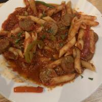 Italian Sausage · Marinara sauce, spicy Italian sausage, mixed peppers, mushrooms, Marsala wine, Parmesan chee...