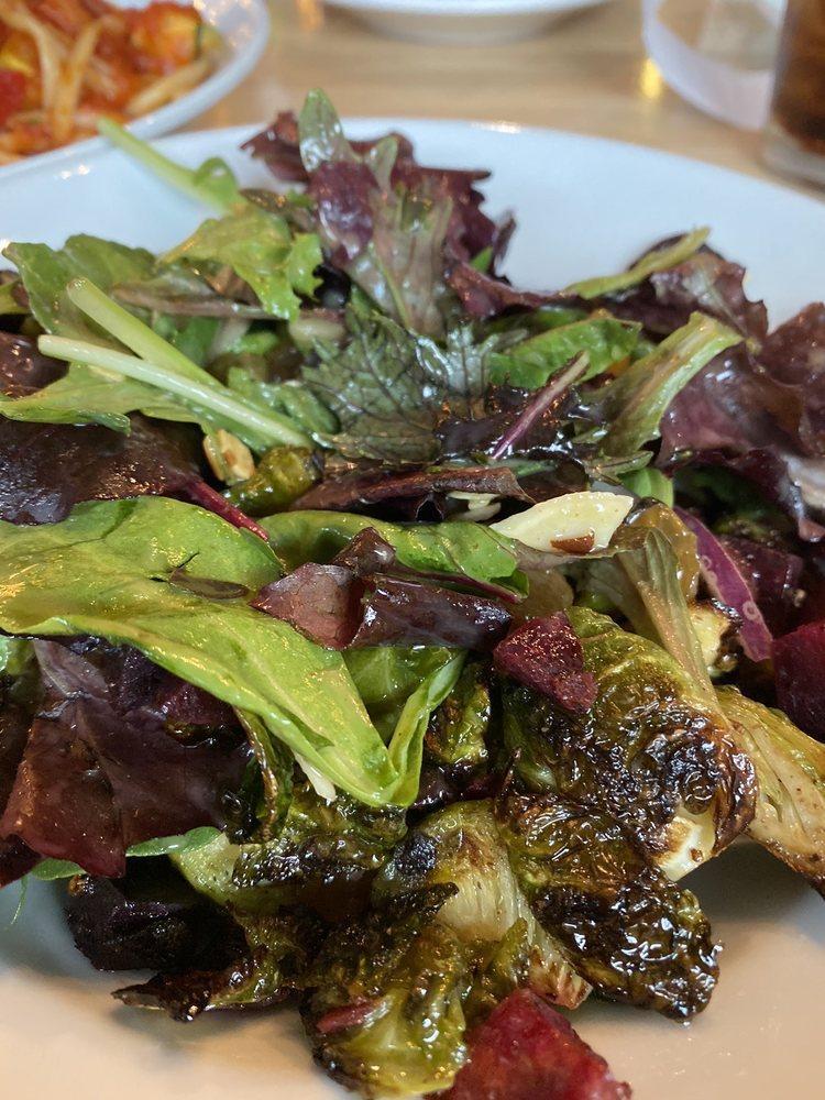 Roasted Brussels Sprouts Beet Salad · Spring lettuce mix, roasted Brussels sprouts, beets, golden raisins, red onions, sliced almonds, goat cheese and champagne vinaigrette.