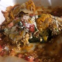 Chile Relleno · Served with Mexican rice and refried beans.