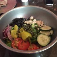 Greek Salad · Romaine lettuce, cucumber, tomatoes, pepperoncini, capers, red onions, black olives, green p...