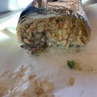 Super Burrito · Filled with beans, rice, cream, cheese, pico and choice of meat.