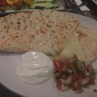 Quesadillas · Piping hot soft tortillas filled with melted cheese, mild chiles, garnished with sour cream ...