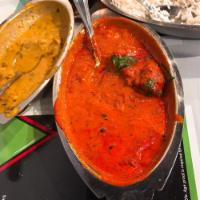 Chicken Korma · Chicken cooked with mildly spiced tomato creamy sauce.