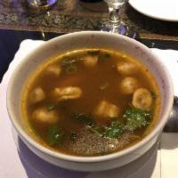 Tom Yum · Thai style hot and sour soup with chicken or shrimp spiced with lemongrass, lime juice, chil...