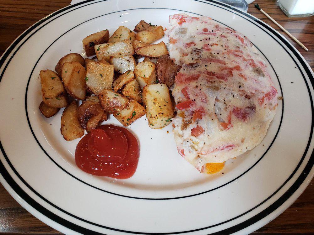 Egg White & Veggie Omelet · Three eggs, spinach, tomatoes, mushrooms, caramelized   onions and crumbled feta cheese. Served with sliced tomatoes.