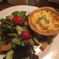 Quiche Lorraine · Housemade with hickory-smoked bacon, green onion, mozzarella and aged parmesan. Served with ...