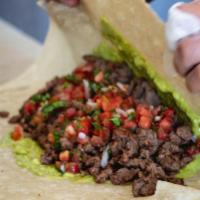 Carne Asada Burrito · Con carne asada, guacamole and pico de gallo.