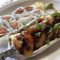 Lion King Roll · California roll topped with baked salmon and special sauce.