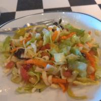 BBQ Chicken Chop Salad · Chopped lettuce, BBQ chicken, cilantro, cucumbers, tomatoes, smoked mozzarella, wontons, cri...