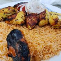Chicken Kebab · Chicken breast and special spices. Platter served on a bed of basmati rice, grilled tomato, ...