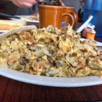 Hobo Eggs · Scrambled eggs, hash browns, onions, bell peppers, tomatoes, and mushrooms, all cooked toget...