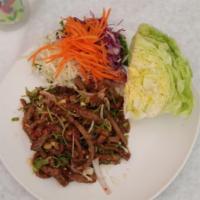 Tiger's Tear Salad · Slices of grilled steak, red onion, green onion, cilantro, roasted rice powder seasoned with...