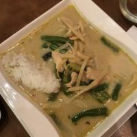 Green Curry · Thai spices blended in green curry paste and coconut milk with string beans, zucchini, bell ...