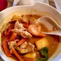 Yellow Curry · Thai spices blended in yellow curry paste and coconut milk, pineapples, tomatoes, red and gr...