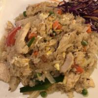 Thai Fried Rice · Stir-fried rice with egg, onions, scallions, tomatoes, peas and carrots.