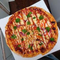 BBQ Chicken Pizza · BBQ sauce, mozzarella cheese, chicken, red bell peppers, red onion and fresh cilantro.