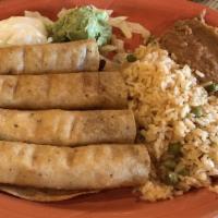 Flautas · Crispy corn tortillas rolled with chicken or beef. Served with sour cream and guacamole. Ser...
