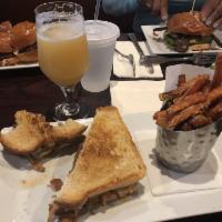 Cajun Melt Burger · Blackened ground beef patty topped with pepper jack cheese, smoked applewood bacon, tobacco ...