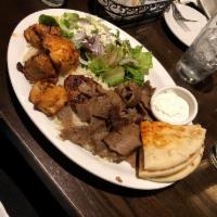 Agora Mixed Grill · Combination of chicken and lamb shish kebabs, Adana and kofte kebabs and lamb and beef gyros...