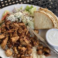 Chicken Gyro · Thinly sliced spit roasted marinated chicken. Served with lettuce, onion, hot sauce and tzat...