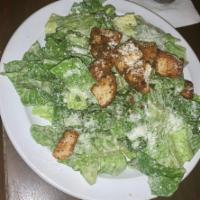 Caesar Salad · Classic preparation with garlic croutons, shredded Parmesan cheese, and our Caesar dressing.