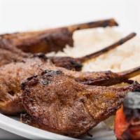 Lamb Chops · Seasoned lamb chops. Include rice, grilled tomato and pita bread.