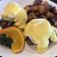 Eggs Benedict · Poached eggs on toasted English muffins with Canadian bacon and topped with Hollandaise sauc...