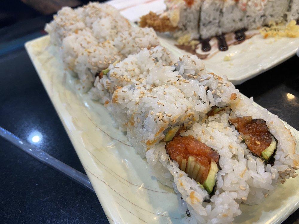 Spicy Tuna Roll · Spicy ahi tuna, avocado, and coated with sesame seeds and cucumber.