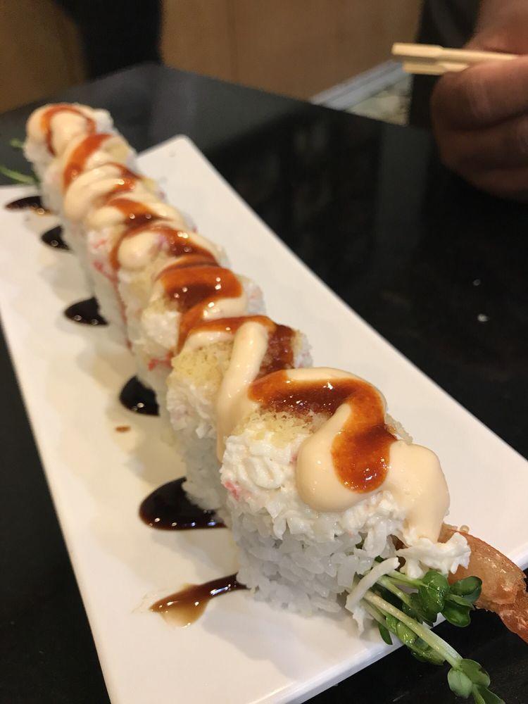 King Kong Roll · Fresh shrimp tempura topped with crab meat, tempura flakes sweet chilli, and house spicy sauce.