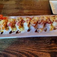 Crunch Mania Roll · Mixed salmon, crab, spicy tuna, shrimp, tempura and tempura flakes wrapped with soy pepper, ...