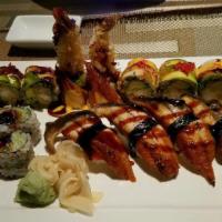 Fresh Dragon Roll · Shrimp tempura, avocado, topped with eel, avocado caviar with spicy sauce and eel sauce.