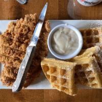Chicken and Waffles · Golden brown waffles topped with hand-breaded chicken breast.