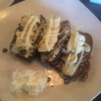 Banana Nut Bread French Toast · Fresh from the bakery banana nut bread made French toast style, topped with banana slices & ...