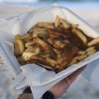 The Classic Poutine · Cheese curd and gravy.