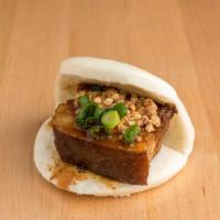 Pork Belly · Melt-in-your-mouth pork belly, topped with fresh cucumber, cilantro, hoisin sauce and peanuts.