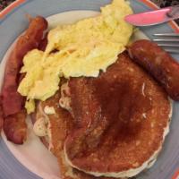 Lumberjack · Pancakes with 2 eggs, any style, 2 strips of bacon, 1 sausage, and ham.