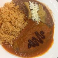 Chile Relleno · Poblano pepper stuffed with fresco cheese served with a sauce made with chipotle and tomatoe...