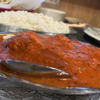 Tikka Masala · Boneless lamb pieces grilled in tandoor and cooked in a mild creamy tomato gravy.