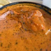 Chicken Tikka Masala · Boneless chicken pieces grilled in tandoor and cooked in a mild creamy tomato gravy.