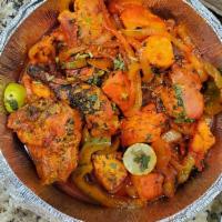 Tandoori Chicken · Marinated chicken cooked in the clay oven.