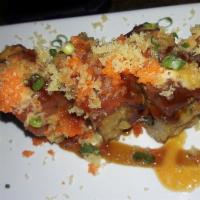 Hot Mama Roll · Tempura fried (smoked salmon, cream cheese and avocado) topped with spicy tuna, masago, scal...
