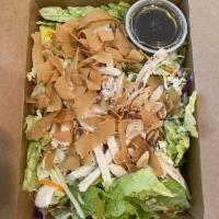 Asian Chicken Salad · Fresh greens, cabbage, ginger soy vinaigrette topped with Asian marinated chicken breast, fr...