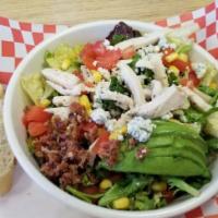 Cobb Salad · Mixed greens, balsamic vinaigrette topped with chicken, tomatoes, corn, blue cheese, avocado...