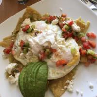 Chilaquiles · 2 eggs, queso crema fresca, avocado and pico de gallo garnish on chips tossed in a green chi...