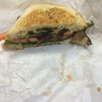 Roasted Vegetable Sandwich · Eggplant and zucchini, lettuce, tomatoes and provolone on sourdough.