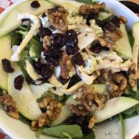 Spinach and Pear Salad · Fresh spinach leaves, champagne vinaigrette with pears, dried cranberries, candied walnuts a...