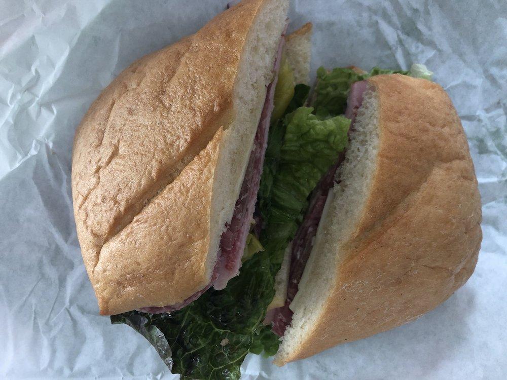 Italian Sub Sandwich · Ham, salami, prosciutto, lettuce, onion, pepperoncini and provolone on a french roll.